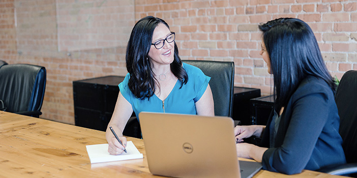 Two women working together in the office